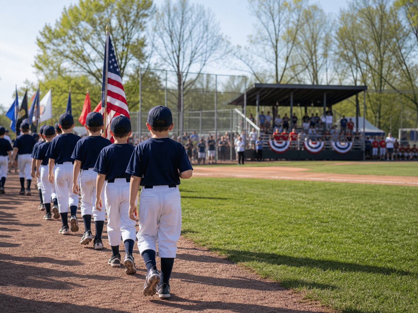 Youth baseball players walking onto a field during opening day.